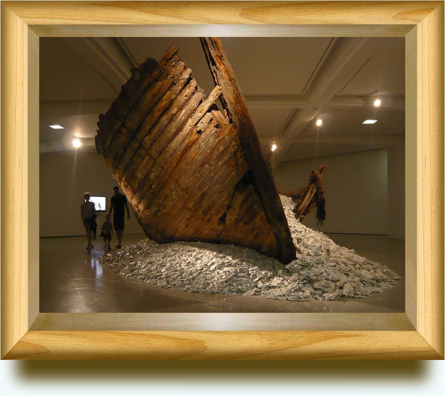 Cai Guo-Qiang (b. 1957 in Quanzhou, Fujian Province, China. Lives and works in New York). Reflection — A gift from Iwaki. 2004. Excavated wooden boat and porcelain. Caspar H. Schübbe Collection. An enormous excavated wooden boat, found in Iwaki, Japan, the hull is filled with and spills out buckets and buckets of mostly white (some light blue) Chinese porcelain figurines, dishes and other common vessels. Installed at MAMAC, Cimiez, Nice, Provence-Alpes-Cote d’Azur, France.