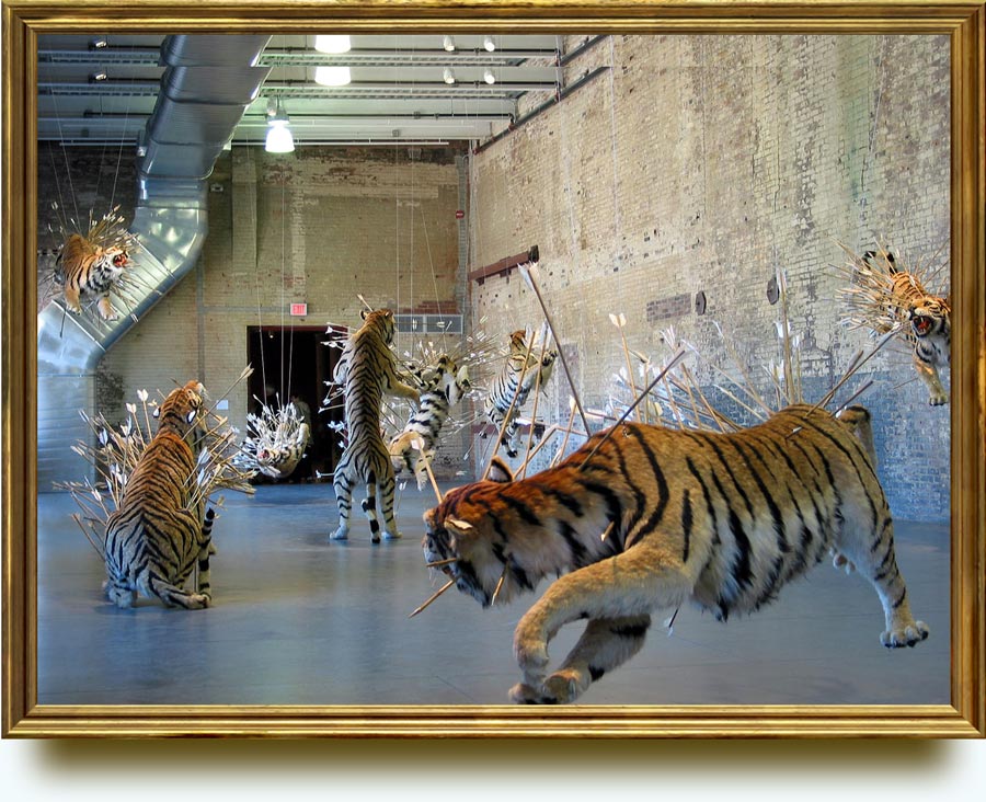 Cai Guo-Qiang (b. 1957 in Quanzhou City, Fujian Province, China. Lives and works in in New York since 1995). Inopportune: Stage Two. 2004. Tigers: paper mache, plaster, fiber glass, resin, painted hide. Arrows: brass, bamboo, feathers. Stage prop: styrofoam, wood, canvas, acrylic paint. Installation view: “Cai Guo-Qiang: Inopportune”, MASS MoCA, North Adams, MA, US. Collection of the artist.