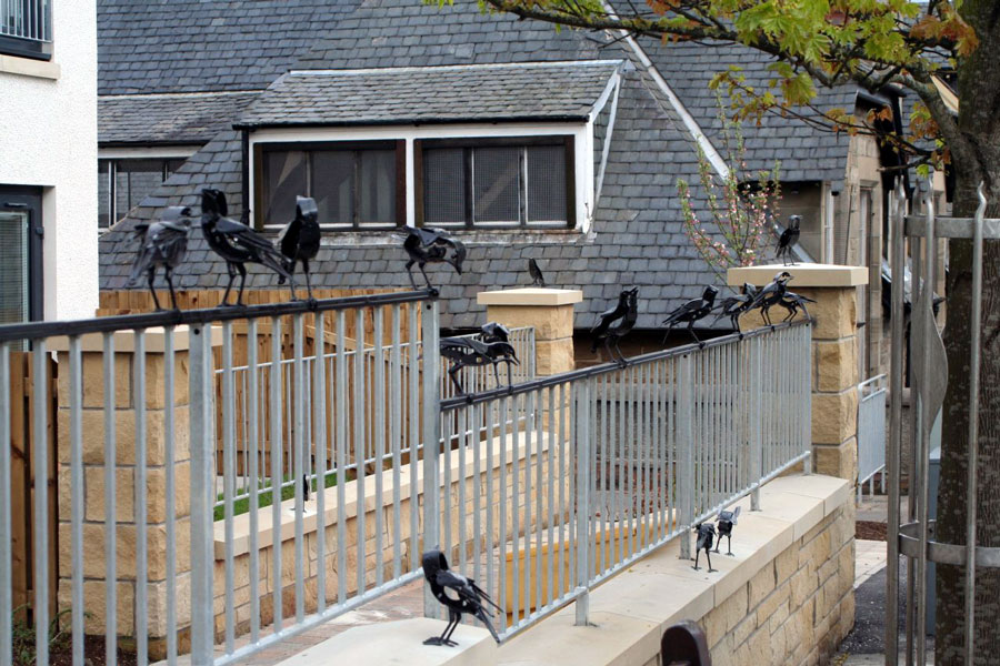 Helen Denerley (b. 1956 in Roslin, Midlothian, Scotland. Now living in Strathdon, Aberdeenshire, Scotland).  Starlings, Loanhead Commission from Hart Builders to make thirty starlings for railings in a new housing complex in Loanhead, 2021.